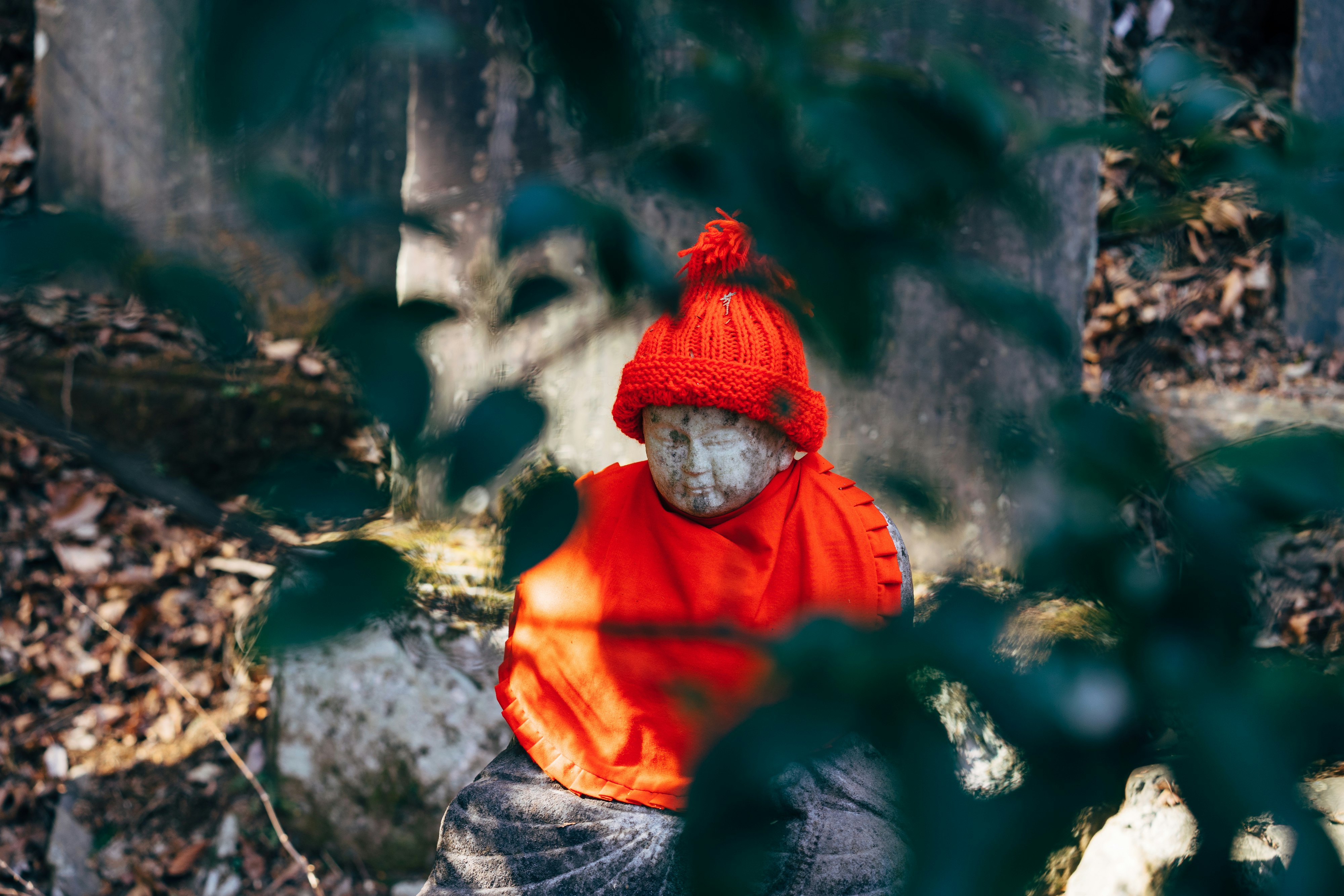 statue with red knit cap